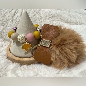 Keychain Wristlet. 
Silicone beaded bracelet with a brown Pom Pom.